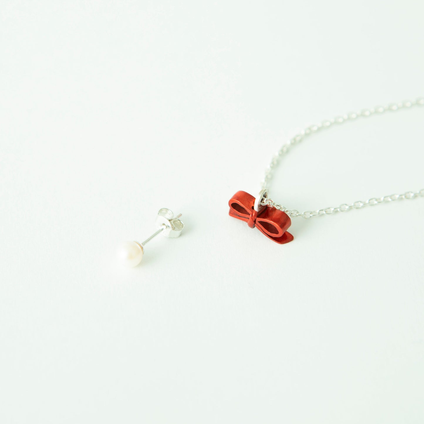 “Through the Ribbon” - Necklace & Pierce