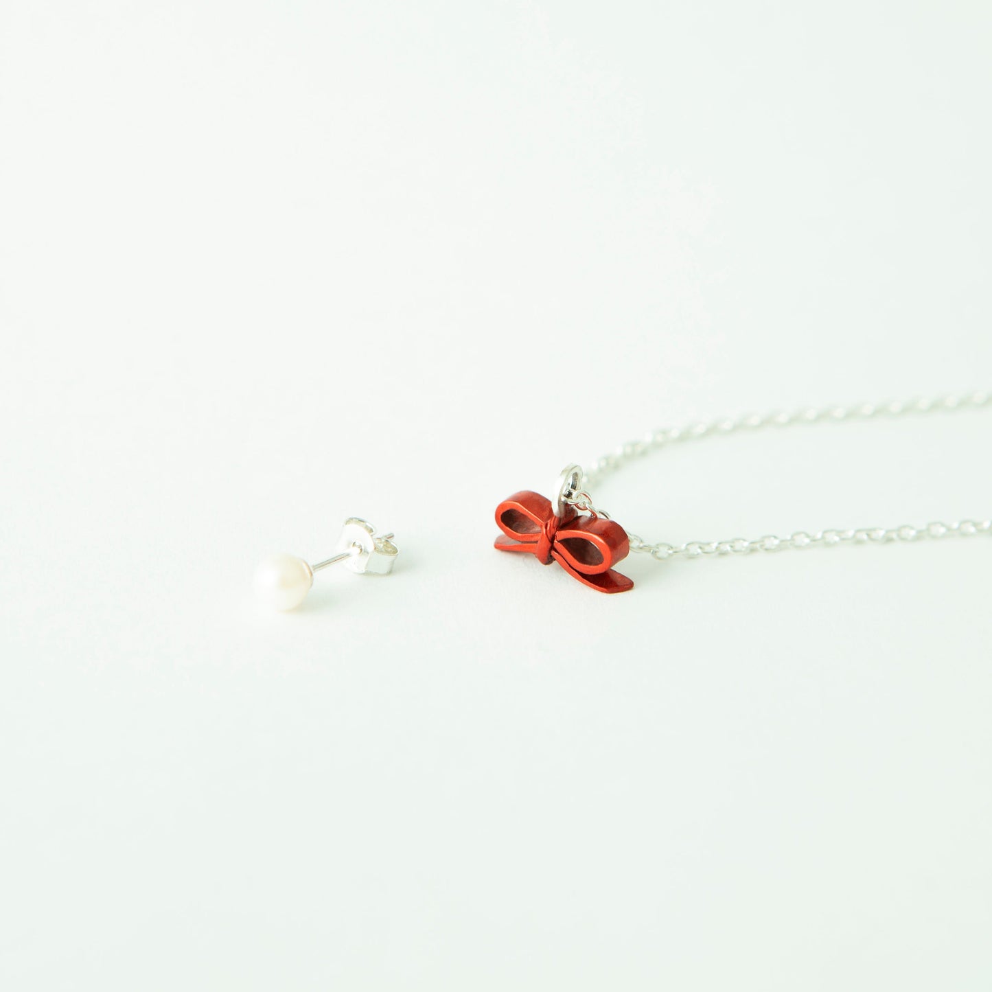 “Through the Ribbon” - Necklace & Pierce